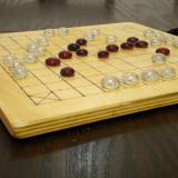 Basic 37-piece Hnefatafl Game in play, close-up.